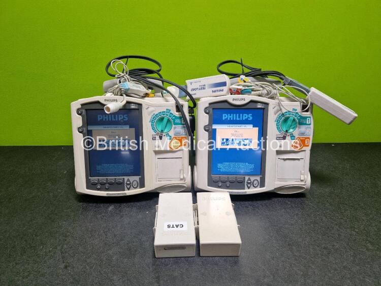 2 x Philips Heartstart MRx Defibrillator (Both Power Up with Stock Module Stock Module Not Included) Including Pacer, ECG and Printer Options with 4 x Philips M3538A Li-Ion Batteries, 2 x Paddle Lead, 2 x M3725A Test Loads and 2 x 3 Lead ECG Leads