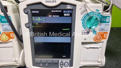 2 x Philips Heartstart MRx Defibrillator (Both Power Up with Stock Module Stock Module Not Included) Including Pacer, ECG and Printer Options with 4 x Philips M3538A Li-Ion Batteries, 2 x Paddle Lead, 2 x M3725A Test Loads and 2 x 3 Lead ECG Leads - 2