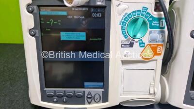 2 x Philips Heartstart MRx Defibrillator (Both Power Up with Stock Module Stock Module Not Included) Including Pacer, ECG and Printer Options with 4 x Philips M3538A Li-Ion Batteries, 2 x Paddle Lead, 2 x M3725A Test Loads and 2 x 3 Lead ECG Leads - 3