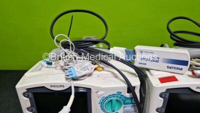 2 x Philips Heartstart MRx Defibrillator (Both Power Up with Stock Module Stock Module Not Included) Including Pacer, ECG and Printer Options with 4 x Philips M3538A Li-Ion Batteries, 2 x Paddle Lead, 2 x M3725A Test Loads and 2 x 3 Lead ECG Leads - 4