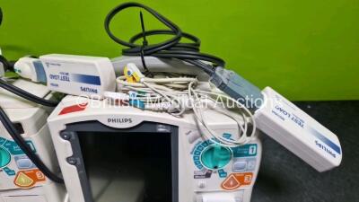 2 x Philips Heartstart MRx Defibrillator (Both Power Up with Stock Module Stock Module Not Included) Including Pacer, ECG and Printer Options with 4 x Philips M3538A Li-Ion Batteries, 2 x Paddle Lead, 2 x M3725A Test Loads and 2 x 3 Lead ECG Leads - 5