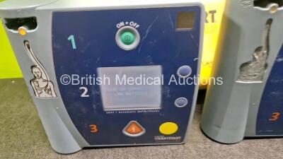 Job Lot Including 1 x Philips FR2+ Defibrillator (No Power) 1 x Laerdal FR2+ Defibrillator (Powers Up with Faulty Screen, 1 x Laerdal FR2 Defibrillator (Powers Up) with 2 x Cases 1 x and LiMno2 Battery - 2