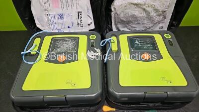 2 x Zoll AEDPro Defibrillators (Both Power Up, Both with Damage to Screen - See Photo) in Case with 2 x 3 Lead ECG Leads and 2 x Li-ion Batteries - 2