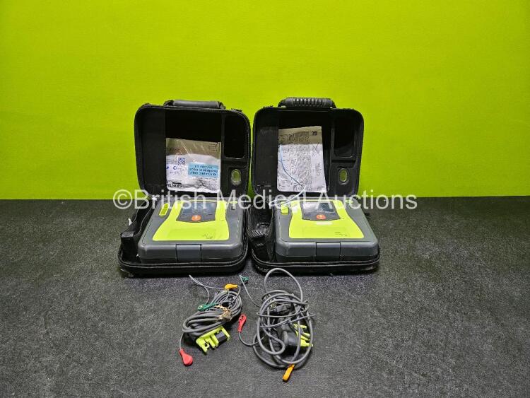 2 x Zoll AEDPro Defibrillators (Both Power Up Both with Damage to Screen - See Photo) in Case with 2 x 3 Lead ECG Leads and 2 x Li-ion Batteries