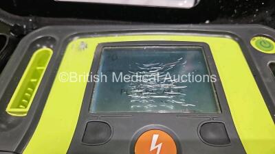 2 x Zoll AEDPro Defibrillators (Both Power Up Both with Damage to Screen - See Photo) in Case with 2 x 3 Lead ECG Leads and 2 x Li-ion Batteries - 3