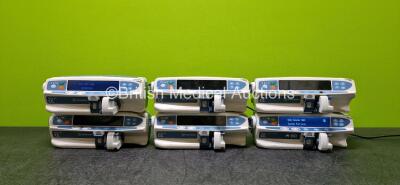 Job Lot Including 5 x CareFusion CC Alaris Plus Syringe Pumps (2 x Power Up and 3 x Draws Power, 1 x Cracked Casing - See Photo) and 1 x BD Alaris Guardrails CC Syringe Pump *Mfd 2020* (Powers Up) *SN 372088714 / 370003630 / 370003597 / 370003619 / 370003