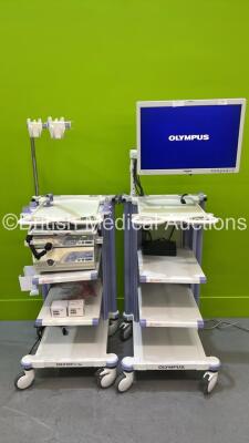 2 x Olympus Stack Trolleys with Olympus OEV261H Monitor, Olympus Evis Lucera CV-260SL Digital Processor, Olympus Evis Lucera CLV-260SL Light Source and Olympus MAJ-1154 PIgtail (All Power Up) *7245707 / 7242034 / 7238452*