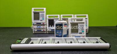 Job Lot including 1 x CareFusion Alaris GP Plus Infusion Pump (Damaged Handle - See Photo), 1 x Baxter Colleague 3 Infusion Pump, 4 x Baxter Colleague Infusion Pump and 1 x Alaris Asena DS Docking Station *SN 135187980 / DS800818856 / 21060913DB / 2103008