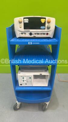 Eschmann TD830 Electrosurgical Unit (Powers Up with Alarm and Blank Screen) and Covidien Smoke Evacuator on Covidien Trolley