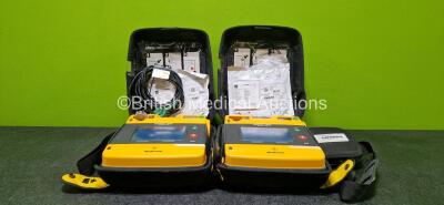 2 x Medtronic Lifepak 1000 Defibrillators (Both Power Up) with 1 x 3 Lead ECG Lead and 1 x Li/MnO2 Battery and 2 x Electrodes *1 x Expired and 1 x Expiry Date 2026* in Carry Cases *SN 37341029 / 38185835*