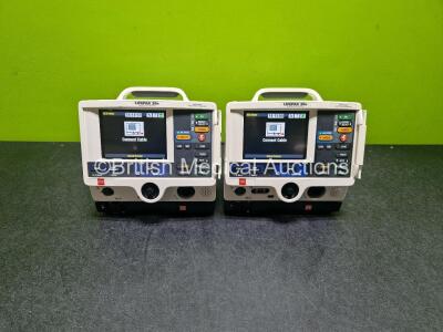 2 x Physio Control Lifepak 20e Defibrillators / Monitors (Both Power Up Both 1 x with Crack in Casing - See Photos ) Including Pacer, ECG and Printer Options with 2 x Li-ion Batteries and 2 x Code Management Modules Including CO2 Options