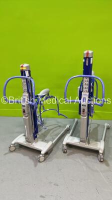 2 x Arjo MaxiMove Electric Patient Hoists with 2 x Batteries and 2 x Controllers (Both Power Up)