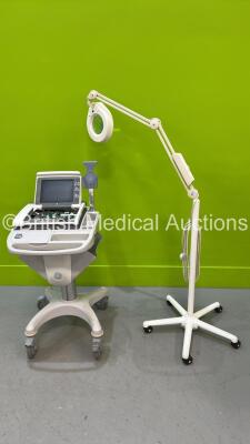 1 x GE MAC5500 ECG Machine (Spares / Repairs) and 1 x Luxo Examination Light on Stand (No Power)