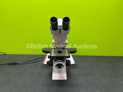 Leica DM2500 Bench Binocular Microscope (Powers Up with Good Bulb) with 2 x HC PLAN s 10 x /22 Lens and 2 x Optics Including 1 x HC PL Fluotar 10 x /0.30 and 1 x C Plan 4 x /0.10