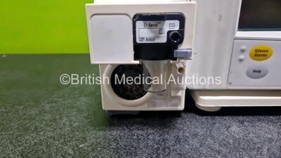 GE Datex Ohmeda F-CM1-05 Anaesthesia Monitor (Powers Up) with 1 x GE E-PRESTN-00 Module with ECG, SpO2, NIBP, T1-T2 and P1-P2 Options and 1 x GE Type E-CAi0-00 Module (Crack in Casing - See Photo) with D-Fend Water Trap *SN - 3