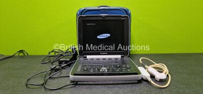 Samsung HM70A Portable Ultrasound *Mfd 2015* (Powers Up, HDD Removed and Cracked Casing - See Photo) with 1 x Samsung CA1-7AD Transducer / Probe *Mfd 2015* (Damaged Casing and Mark on Head - See Photo) and 1 x AC Power Supply in Carry Case