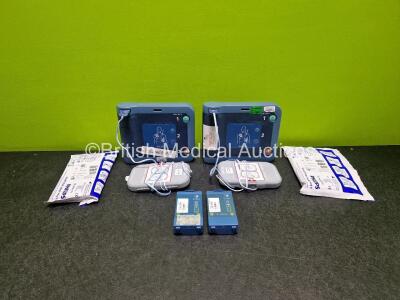 2 x Philips Heartstart FRx Defibrillators (Both Power Up) in Case with 4 x M5070A LiMnO2 Batteries *Install Before 2029 / 2027 / 2027 / 2026 * and 4 x Smart Pads 2