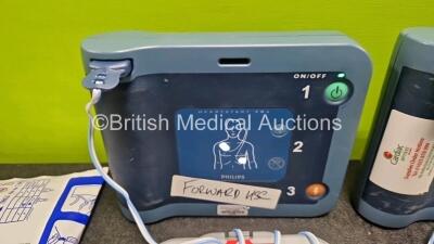 2 x Philips Heartstart FRx Defibrillators (Both Power Up) in Case with 4 x M5070A LiMnO2 Batteries *Install Before 2029 / 2027 / 2027 / 2026 * and 4 x Smart Pads 2 - 2