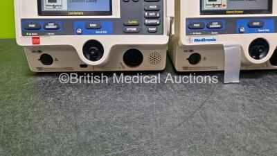 2 x Physio Control Lifepak 20e Defibrillators / Monitors *Mfd - 2013 / 2015 (Both Power Up Both 1 x with Damage - See Photo) Including Pacer, ECG and Printer Options *SN 42310748 / 41178404* - 4