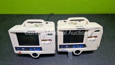 2 x Physio Control Lifepak 20e Defibrillators / Monitors *Mfd - 2013 / 2015 (Both Power Up Both 1 x with Damage - See Photo) Including Pacer, ECG and Printer Options *SN 42310748 / 41178404* - 5