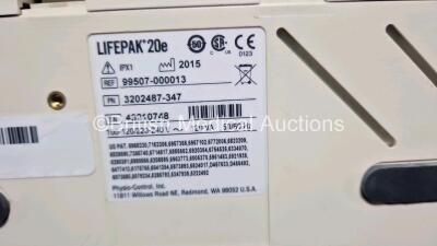 2 x Physio Control Lifepak 20e Defibrillators / Monitors *Mfd - 2013 / 2015 (Both Power Up Both 1 x with Damage - See Photo) Including Pacer, ECG and Printer Options *SN 42310748 / 41178404* - 6