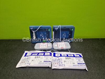 2 x Philips Heartstart FRx Defibrillators (Both Power Up) in Case with 2 x M5070A LiMnO2 Batteries *Install Before 2024 / 2020 and 4 x Smart Pads 2