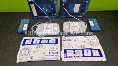 2 x Philips Heartstart FRx Defibrillators (Both Power Up) in Case with 4 x M5070A LiMnO2 Batteries *Install Before 2024 / 2024 / 2023 / 2018 * and 4 x Smart Pads 2 - 4