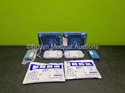 2 x Philips Heartstart FRx Defibrillators (Both Power Up) in Case with 4 x M5070A LiMnO2 Batteries *Install Before 2027 / 2025 / 2025 / 2024* and 4 x Smart Pads 2