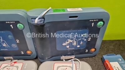 2 x Philips Heartstart FRx Defibrillators (Both Power Up) in Case with 4 x M5070A LiMnO2 Batteries *Install Before 2029 / 2027 / 2026 / 2024* and 4 x Smart Pads 2 - 3