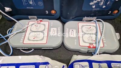 2 x Philips Heartstart FRx Defibrillators (Both Power Up) in Case with 4 x M5070A LiMnO2 Batteries *Install Before 2029 / 2027 / 2026 / 2024* and 4 x Smart Pads 2 - 4