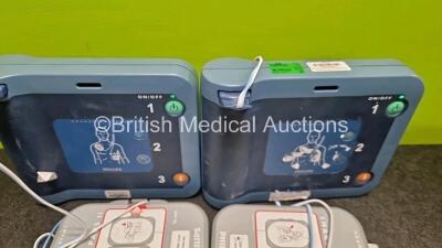 2 x Philips Heartstart FRx Defibrillators (Both Power Up) in Case with 4 x M5070A LiMnO2 Batteries *Install Before 2029 / 2027 / 2026 / 2024* and 4 x Smart Pads 2 - 7