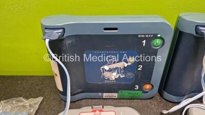 2 x Philips Heartstart FRx Defibrillators (Both Power Up) in Case with 4 x M5070A LiMnO2 Batteries *Install Before 2024 / 2024 / 2023 / 2018 * and 4 x Smart Pads 2 - 2