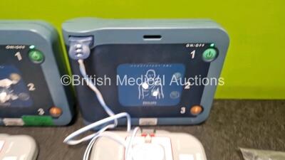 2 x Philips Heartstart FRx Defibrillators (Both Power Up) in Case with 4 x M5070A LiMnO2 Batteries *Install Before 2024 / 2024 / 2023 / 2018 * and 4 x Smart Pads 2 - 3