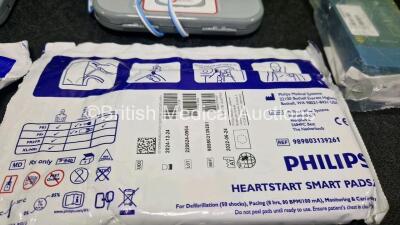 2 x Philips Heartstart FRx Defibrillators (Both Power Up) in Case with 4 x M5070A LiMnO2 Batteries *Install Before 2024 / 2024 / 2023 / 2018 * and 4 x Smart Pads 2 - 6