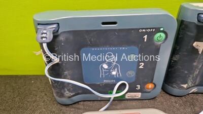 2 x Philips Heartstart FRx Defibrillators (Both Power Up) in Case with 2 x M5070A LiMnO2 Batteries *Install Before 2027 / 2024* and 4 x Smart Pads 2 - 2