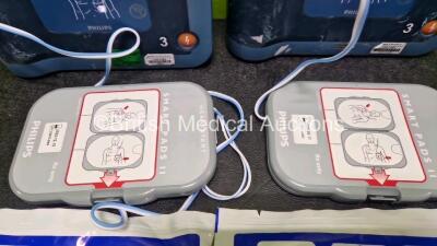 2 x Philips Heartstart FRx Defibrillators (Both Power Up) in Case with 2 x M5070A LiMnO2 Batteries *Install Before 2027 / 2024* and 4 x Smart Pads 2 - 4