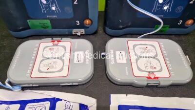 2 x Philips Heartstart FRx Defibrillators (Both Power Up) in Case with 2 x M5070A LiMnO2 Batteries *Install Before 2027 / 2027* and 4 x Smart Pads 2 - 3