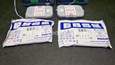 2 x Philips Heartstart FRx Defibrillators (Both Power Up) in Case with 2 x M5070A LiMnO2 Batteries *Install Before 2027 / 2027* and 4 x Smart Pads 2 - 4