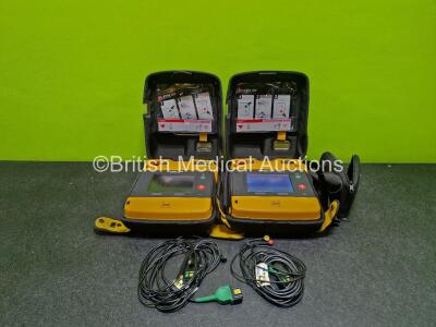 2 x Medtronic Lifepak 1000 Defibrillators (Both Power Up) in Case with 2 x 3 Lead ECG Leads and 1 x Li/Mn02 Battery *SN 42196629 / 42196492*