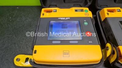 2 x Medtronic Lifepak 1000 Defibrillators (Both Power Up) in Case with 2 x 3 Lead ECG Leads and 1 x Li/Mn02 Battery *SN 42196629 / 42196492* - 3