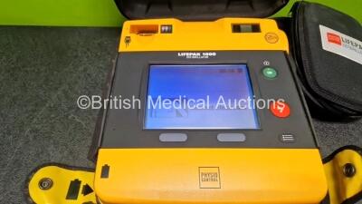 Medtronic Lifepak 1000 Defibrillator (Powers Up) in Case with 2 x 3 Lead ECG Leads and 1 x Li/Mn02 Battery *Install Before - 2029* **SN 42196530** - 2