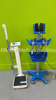 GE Dinamap V100 Monitor on Stand and 1 x Marsden Standing Scale (Both Power Up) *SDT09040357SP*