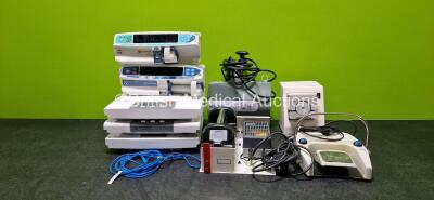 Mixed Lot Including 1 x CareFusion Alaris PK Syringe Pump (Powers Up and Missing Battery - See Photo), 1 x CareFusion Alaris Guardrails Plus CC Syringe Pump For Repair / Spare (Missing Screen and Battery), 2 x Marsden Scales, 1 x Seca Scale, 1 x Arjo Maxi