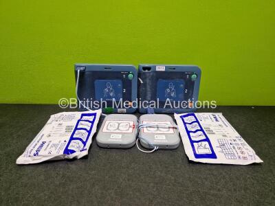 2 x Philips Heartstart FRx Defibrillators (Both Power Up) in Case with 2 x M5070A LiMnO2 Batteries *Install Before 2024 / 2024* and 4 x Smart Pads 2