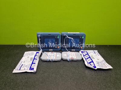 2 x Philips Heartstart FRx Defibrillators (Both Power Up) in Case with 2 x M5070A LiMnO2 Batteries *Install Before 2024 / 2024* and 4 x Smart Pads 2