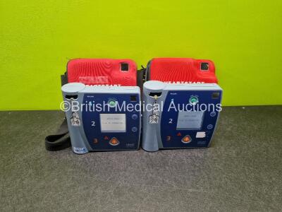 2 x Philips Heartstart FR2+ Defibrillators (Both Power Up) in Case with 2 x LiMnO2 Batteries *Install Before 2022 / 2022* **SN 0710800359 / 0204111313*