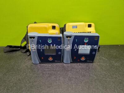 2 x Laerdal Heartstart FR2 Defibrillators (Both Power Up) in Case with 1 x LiMnO2 Battery *Install Before 2024* **SN 0401029111 / 0202053447*