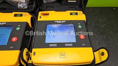 2 x Medtronic Lifepak 1000 Defibrillators *Mfd 2015 / 2015 (Both Power Up) in Case with 2 x 3 Lead ECG Leads and 2 x Li/Mn02 Batteries *Install Before 2029 / 2024 - 2