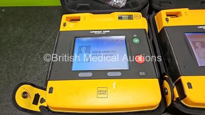 2 x Medtronic Lifepak 1000 Defibrillators *Mfd 2015 / 2015 (Both Power Up) in Case with 2 x 3 Lead ECG Leads and 2 x Li/Mn02 Batteries *Install Before 2029 / 2024 - 3