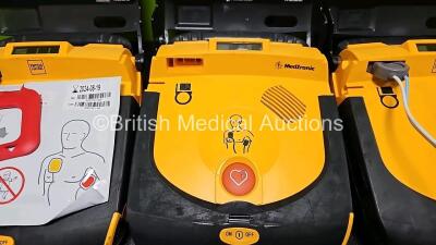 3 x Physio Control Lifepak CR Plus Defibrillators *Mfd - 2016 / 2016 / 2012* (All Power Up) with 1 x Li/S02C12 Battery - 3